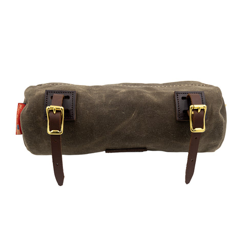 Frost River's handlebar bag attaches to the handlebars with adjustable leather straps. 