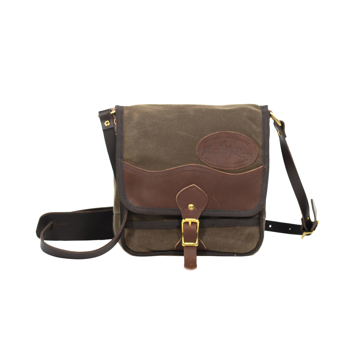 Timeless shoulder bag made from waxed canvas, premium leather, and solid brass.
