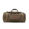 Waxed canvas luggage bag with large exterior pockets and leather handles