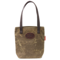 A waxed canvas tote bag with cotton web handles and a leather patch on the front.