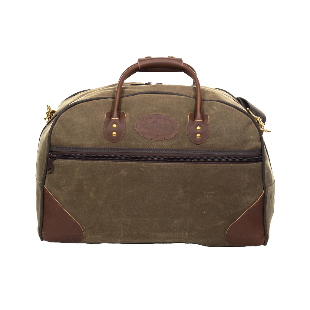 Handcrafted waxed canvas luggage bag, featuring removable a cotton webbed shoulder strap.
