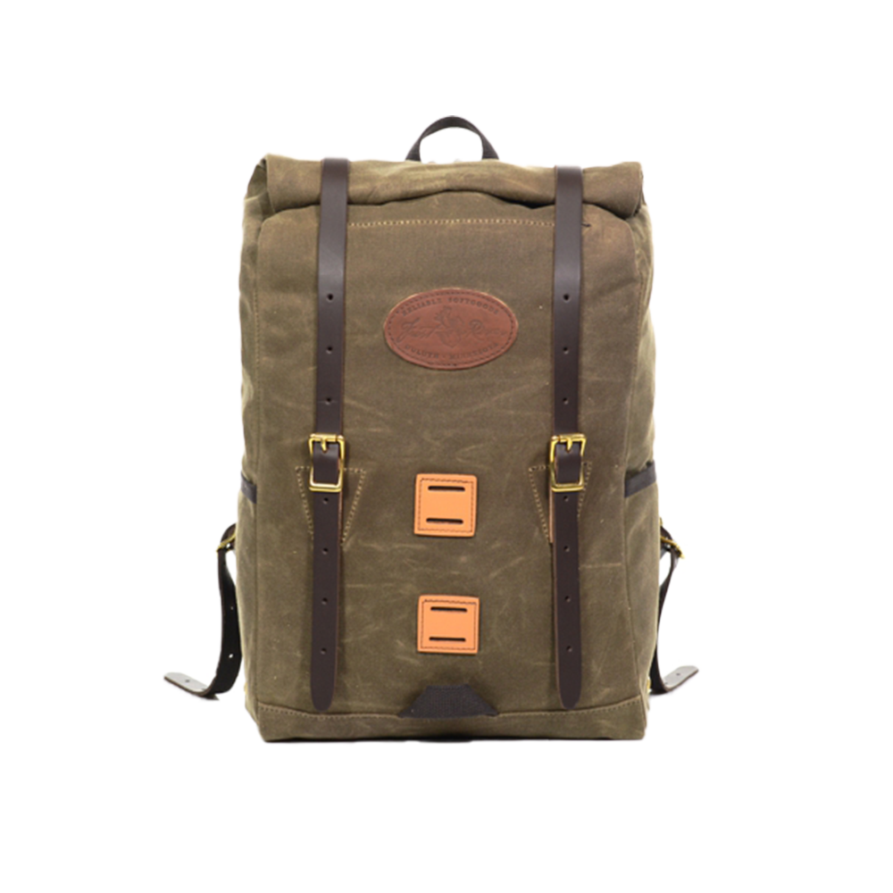 A waxed canvas rolltop daypack with brown leather straps and square squares on front.