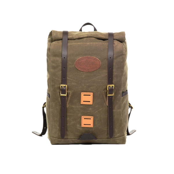 A waxed canvas rolltop daypack with brown leather straps and square squares on front.