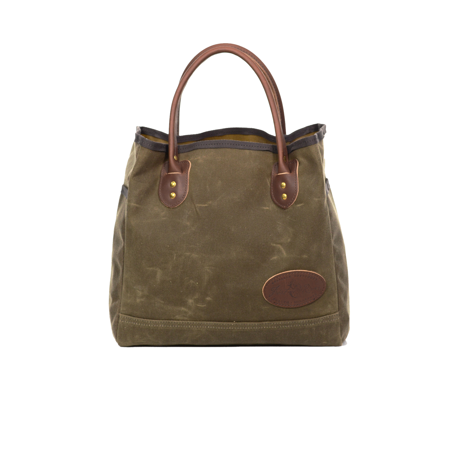 Waxed canvas tote with brown leather handles.