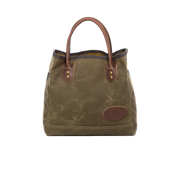 Waxed canvas tote with brown leather handles.