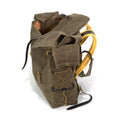 Made with durable waxed canvas, premium leather, and solid brass.