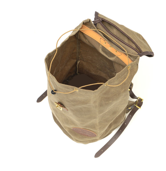 View of the top of the backpack with the lid open and a hanging zippered pocket on the inside to show that his pack can hold a lot of gear.