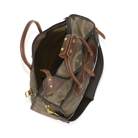Canvas luggage bag, with a zippered top, and a waxed canvas rain flap.