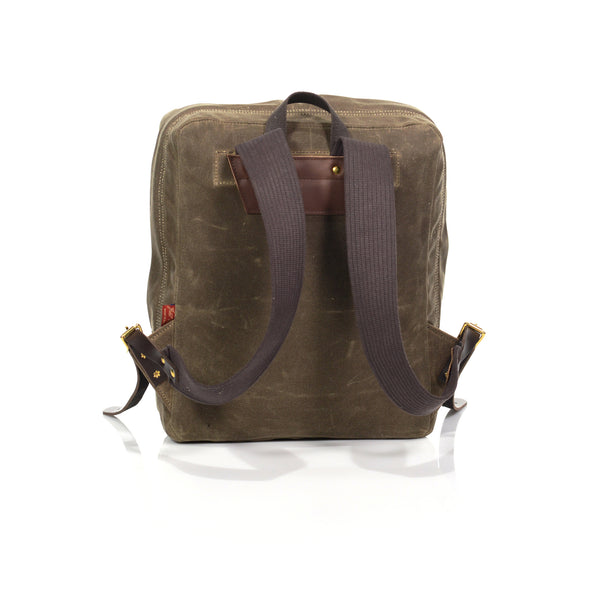 Hand pounded brass rivets and hand sown stitching keep these cotton webbed straps sturdy and in place. 