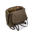 Two side flaps of waxed canvas cover the contents in the bag before the flap is put over and buckles for added protection from the elements.