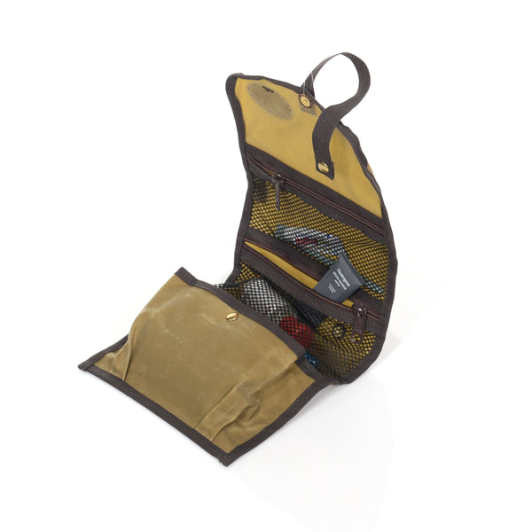 Below the two mesh zippered pockets there is a larger expandable snap closing pocket for additional storage.