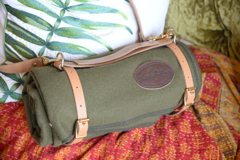 The leather blanket harness is make with chestnut leather and has two straps to hold the bedroll and a third shoulder strap to carry.