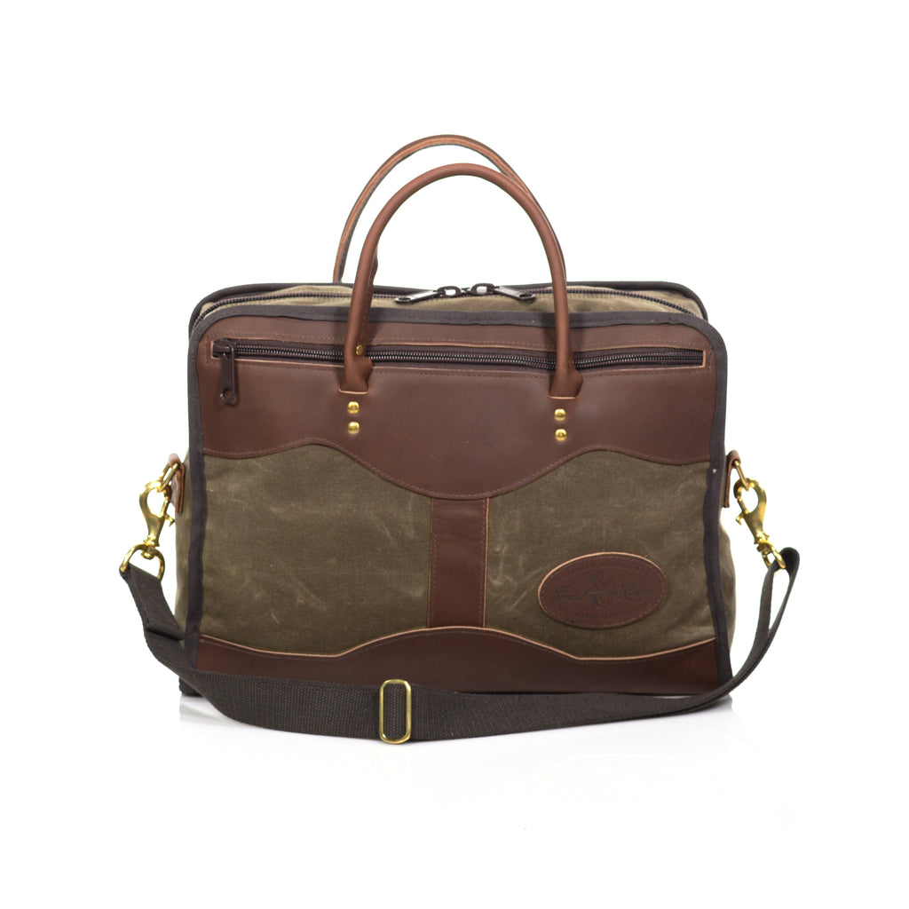 With high-end waxed canvas and premium leather this medium brief is durable and striking. Two leather handles on both sides for carrying and two heavy duty zippers on either side for storage. 