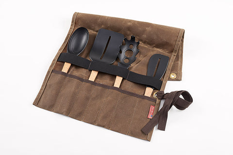 The utensil roll has seven individual pockets that allows cooking utensils and knifes to be slid into.