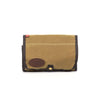 The travel pack is made with high quality, water resistant waxed canvas and this version is tan with brown cotton binding on the edges.