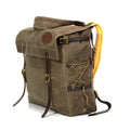 The waxed canvas flap and premium leather straps connect to two solid brass buckles that will keep all your gear secure while traveling.