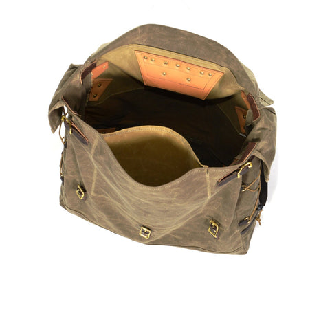 There is a large slip pocket on the front of the pack.  This pocket is typically used to store maps and items that can be quickly accessed.