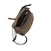 Frost slip pocket next to the main compartment all secured under the leather flap and solid brass buckle.