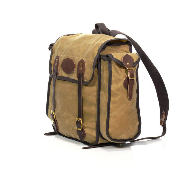 Crafted out of our lighter 10.10 oz highly water resistant waxed canvas. With two side pockets that run the length of bag for additional storage.