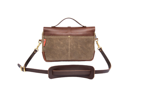 Premium leather shoulder strap and two slide pockets on the back of the bag.