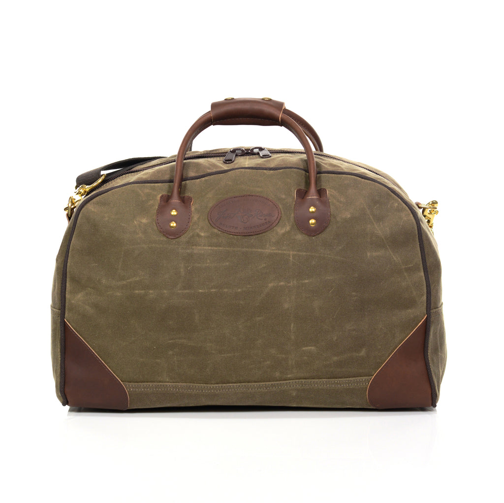 Luggage bag made with durable waxed canvas and premium leather.