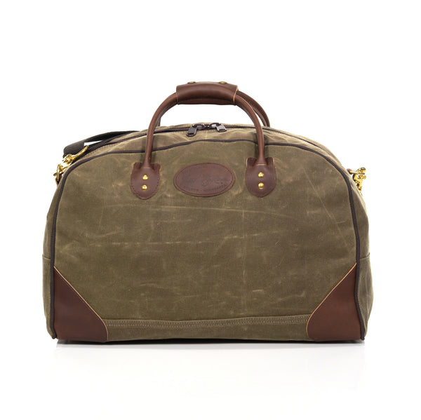 Luggage bag made with durable waxed canvas and premium leather.