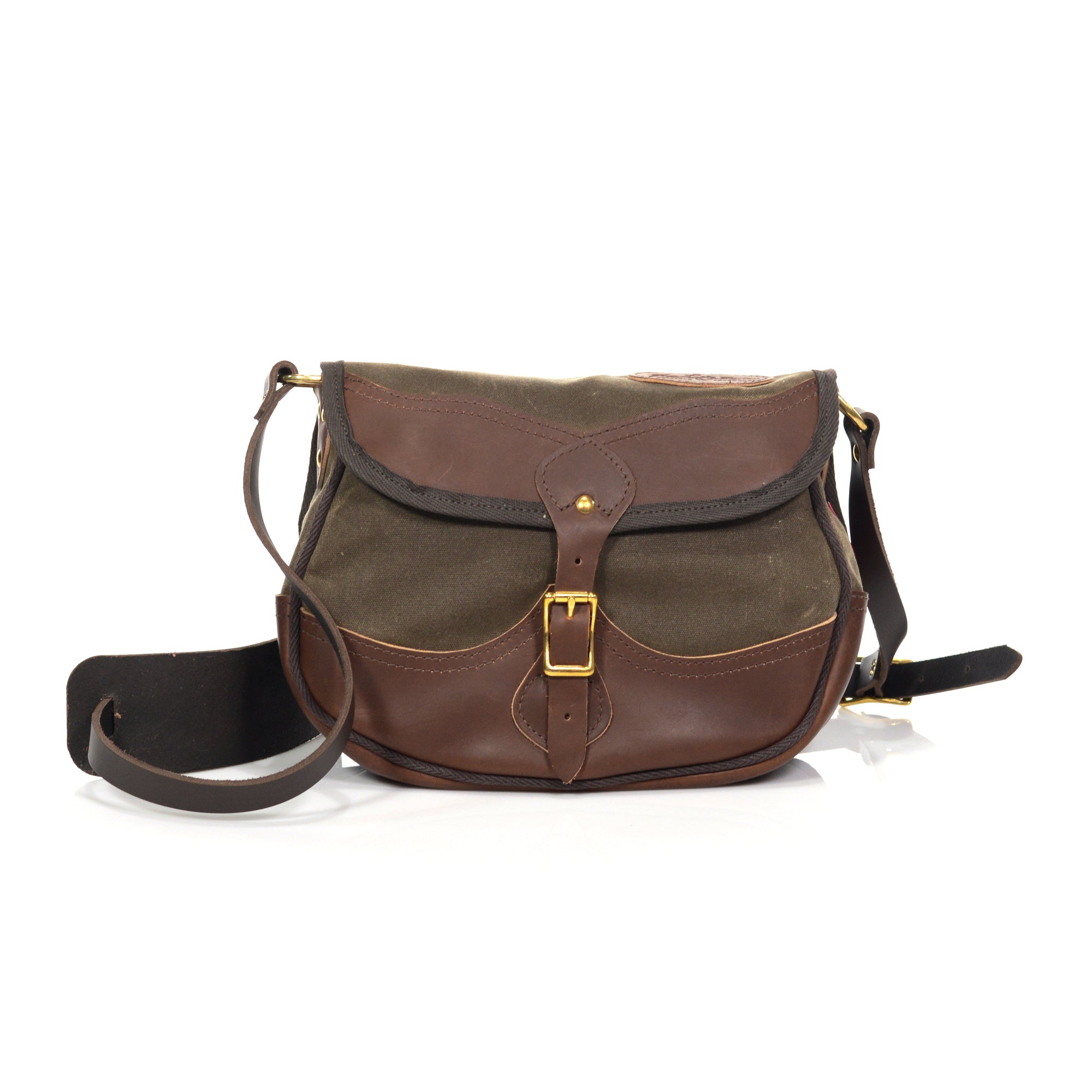 Same design as our shell bag but with added premium leather on the flap and the bottom of the bag.