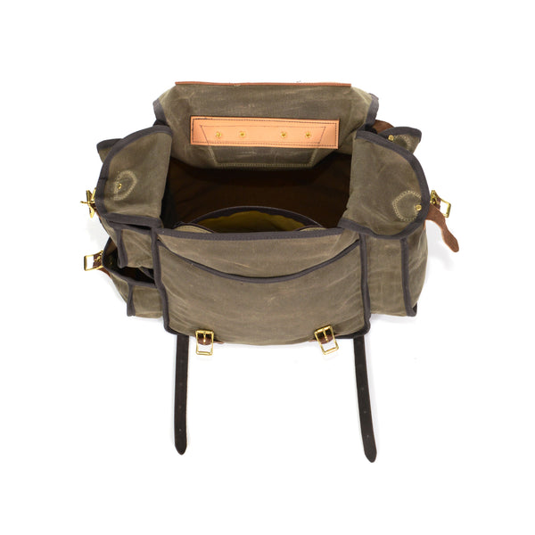 On the inside of this deep pack, there is a additional zippered pocket, made out our high quality waxed canvas, hanging from the top.